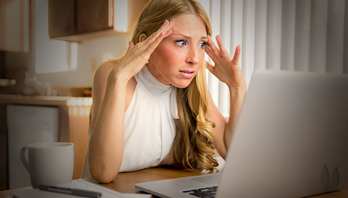 A stressed dance instructor managing her studio online.