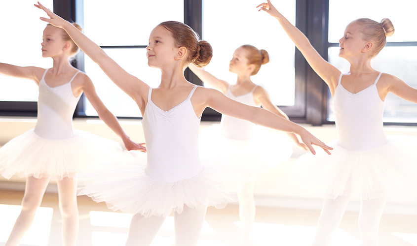 Dance students rehearsing dance moves.