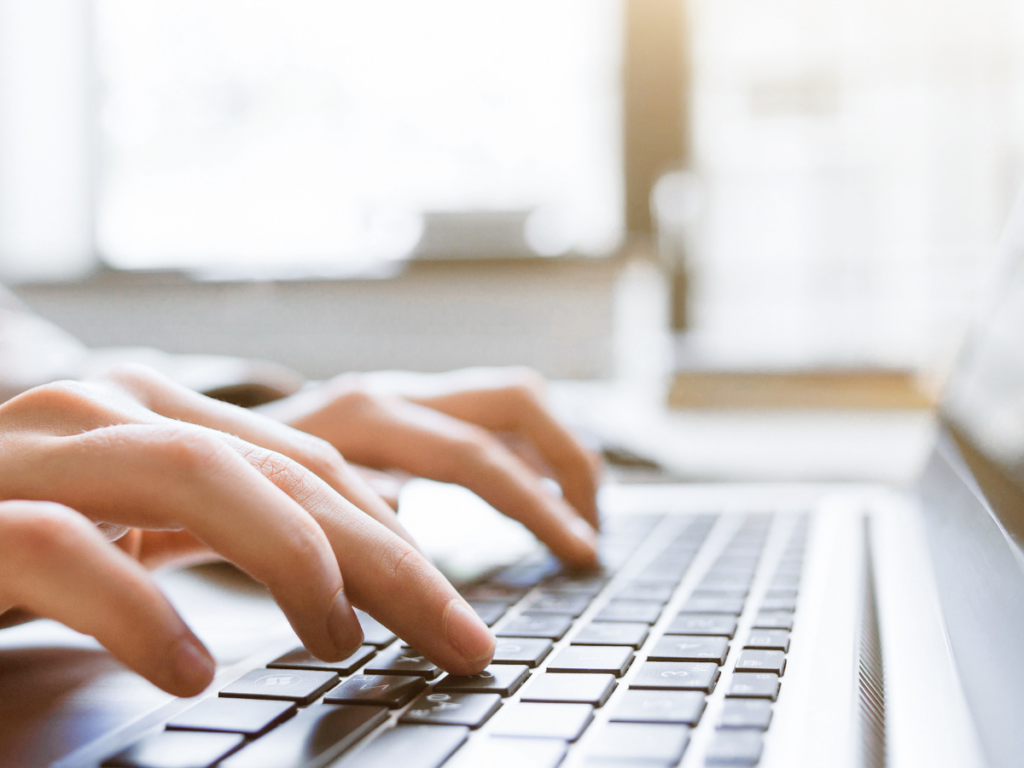 Person typing on a computer