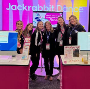jackrabbit staff and clients at tradeshow smiling