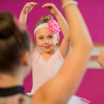 A young dancer rehearses before a recital
