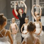 Dance instructor demonstrates movements for students