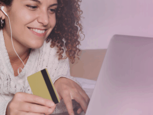 woman-smiling-at-computer-with-card